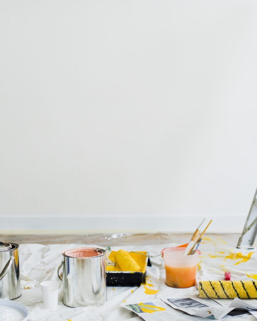 Buckets of paint on the floor